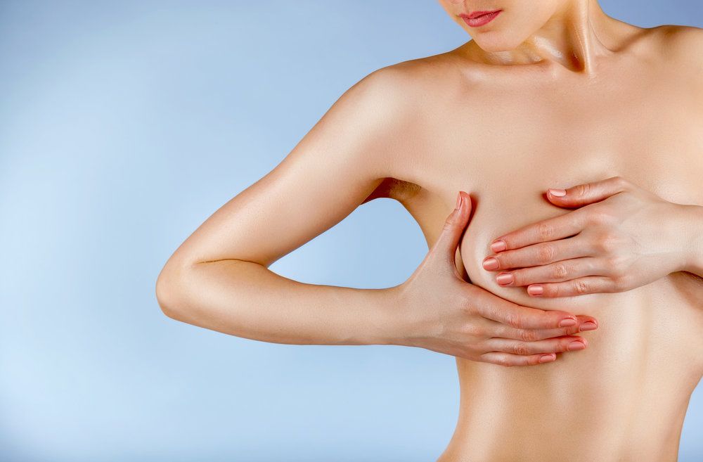 woman covering breast